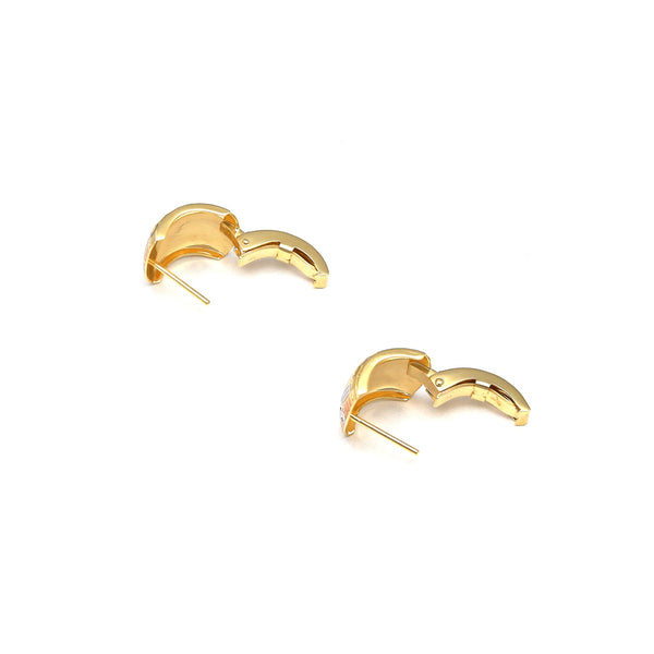 Aretes diseño especial en oro amarillo 14 kilates.