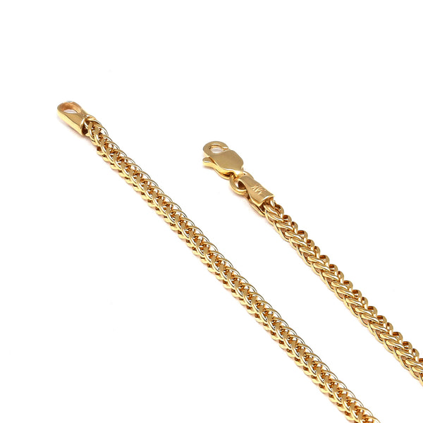 Pulsera eslabón tejido en oro amarillo 14 kilates.