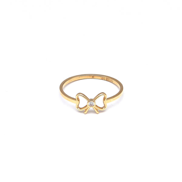 Anillo calado motivo moño con circonia en oro amarillo 14 kilates.