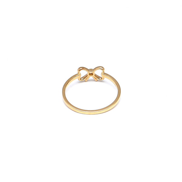 Anillo calado motivo moño con circonia en oro amarillo 14 kilates.