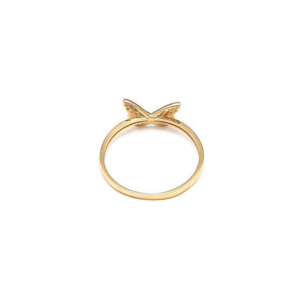 Anillo estilizado motivo mariposa con circonias en oro amarillo 14 kilates.