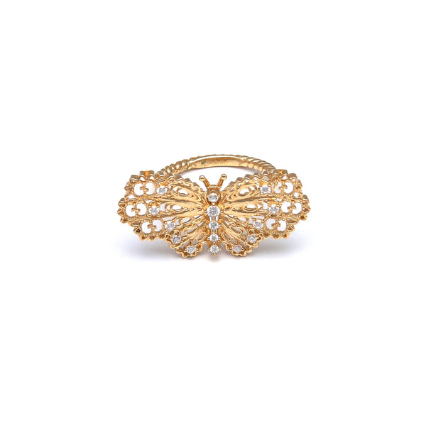 Anillo calado motivo mariposa con circonias en oro amarillo 14 kilates.