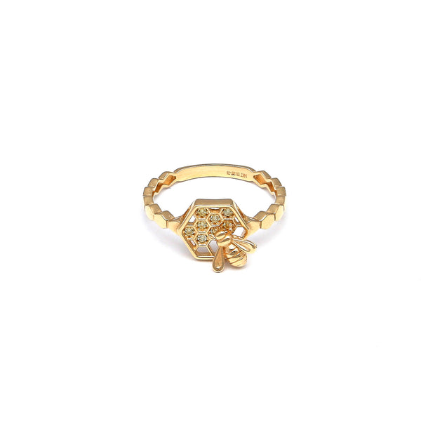 Anillo calado motivo abeja con circonias en oro amarillo 14 kilates.