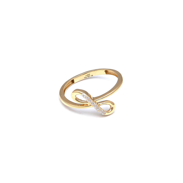 Anillo calado motivo infinito con circonias en oro amarillo 14 kilates.