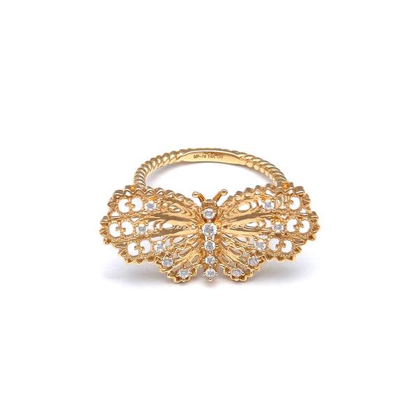 Anillo calado motivo mariposa con sintéticos en oro amarillo 14 kilates.