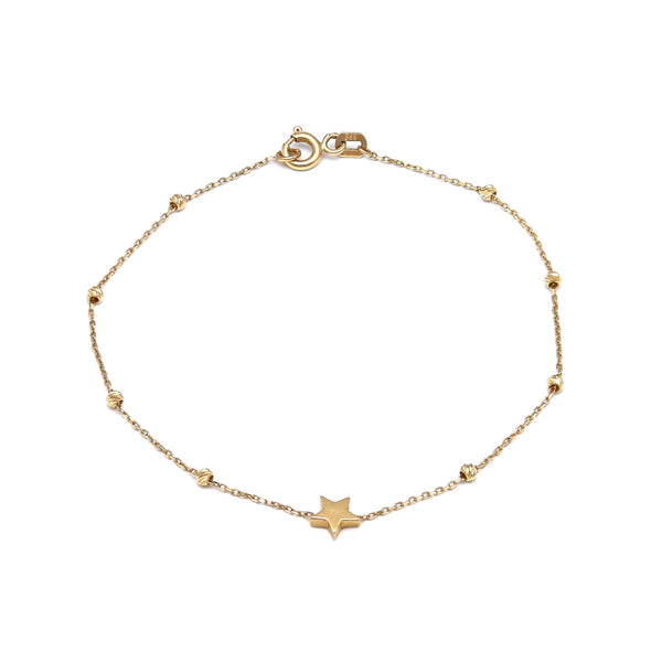 Pulsera eslabón cruzado con esferas y aplicación motivo estrella en oro amarillo 14 kilates.