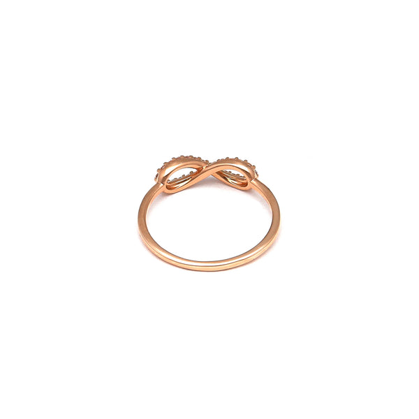 Anillo calado motivo infinito con circonias en oro rosa 14 kilates.