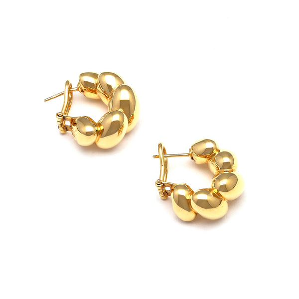 Aretes huecos en oro amarillo 14 kilates.