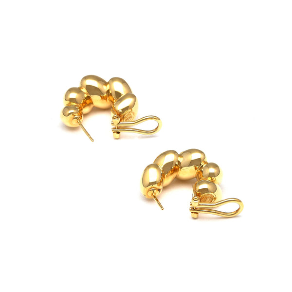 Aretes huecos en oro amarillo 14 kilates.