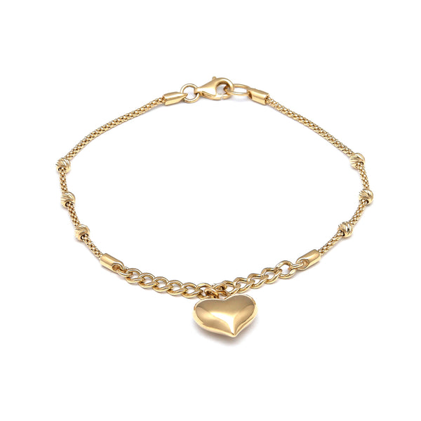 Pulsera eslabón combinado con esferas y colgante motivo corazón en oro amarillo 14 kilates.