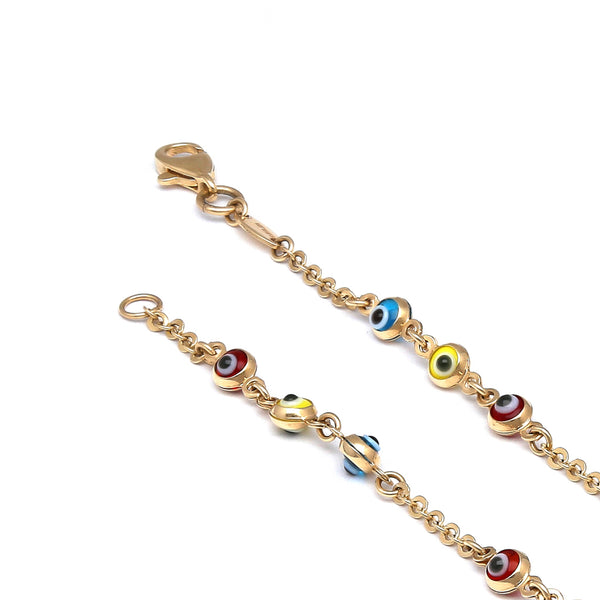 Pulsera eslabón combinado motivo ojos con sintéticos en oro amarillo 14 kilates.