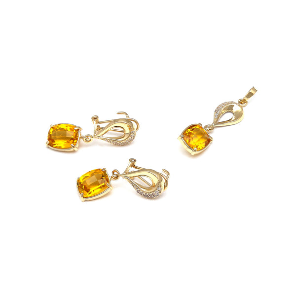 Juego de aretes y dije articulados con citrinos y circonias en oro amarillo 14 kilates.