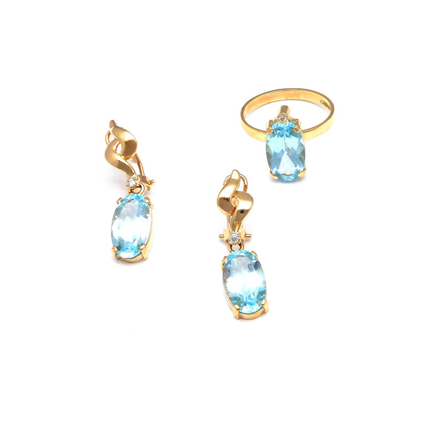 Juego de anillo y aretes diseño especial con diamantes y topacios sky blue en oro amarillo 14 kilates.