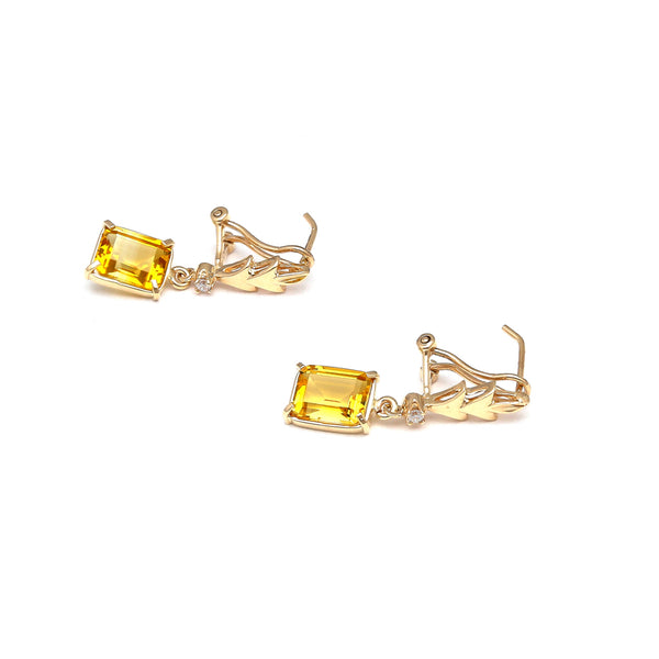 Aretes articulados con citrinos y circonias en oro amarillo 14 kilates.