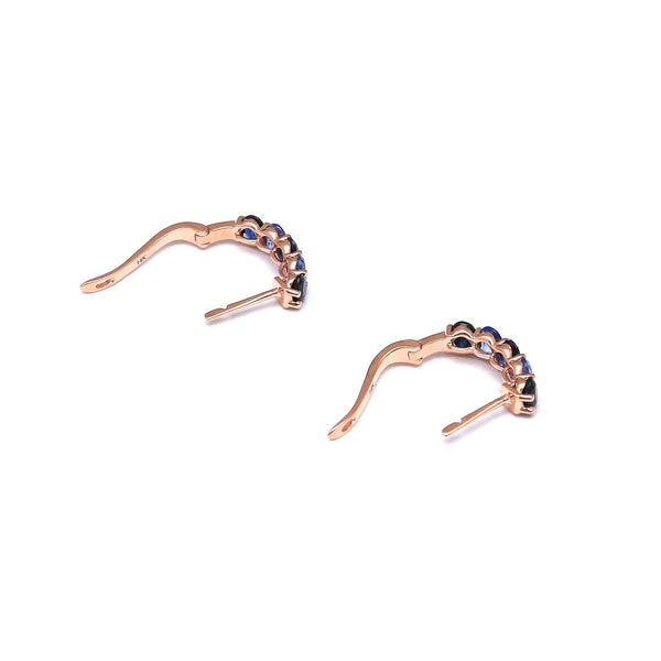 Aretes articulados con zafiros en oro rosa 14 kilates.