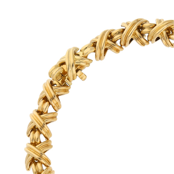 Pulsera eslabón combinado firma Tiffany & Co. en oro amarillo 18 kilates.