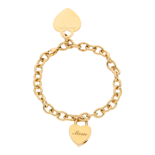 Pulsera eslabón cruzado con colgantes motivo corazón firma Tiffany & Co. en oro amarillo 18 kilates.