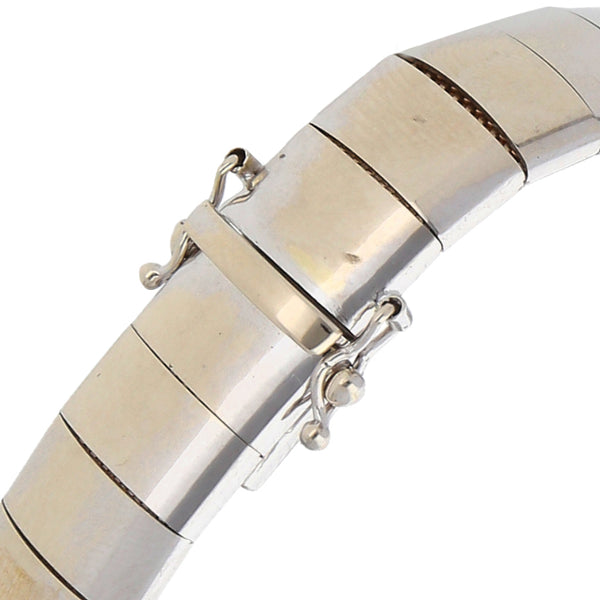 Pulsera eslabón laminado en oro blanco 14 kilates.