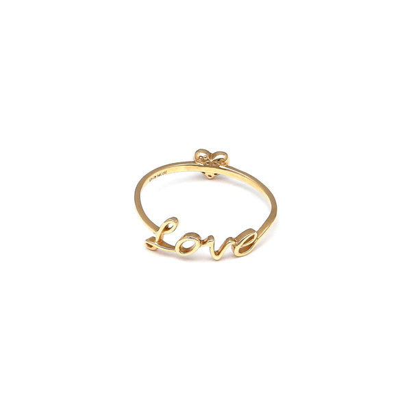 Anillo diseño especial motivo letras y corazón con circonias en oro amarillo 14 kilates.