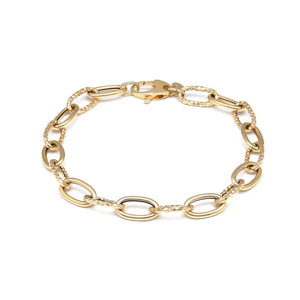 Pulsera eslabón cruzado combinado en oro amarillo 14 kilates.