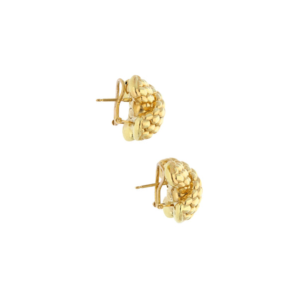 Aretes huecos en oro amarillo 18 kilates.