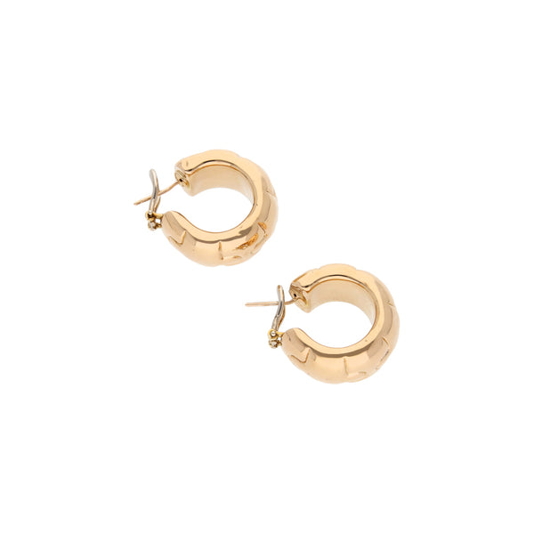 Aretes huecos en oro amarillo 14 kilates.