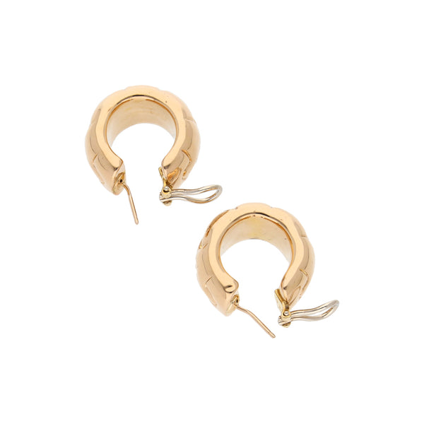 Aretes huecos en oro amarillo 14 kilates.