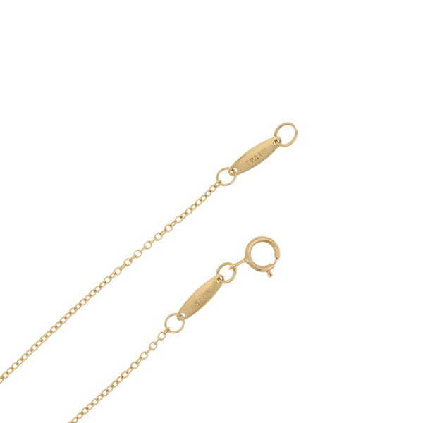 Dije diseño especial motivo corazón y gargantilla eslabón cruzado firma Tiffany & Co. en oro amarillo 18 kilates.