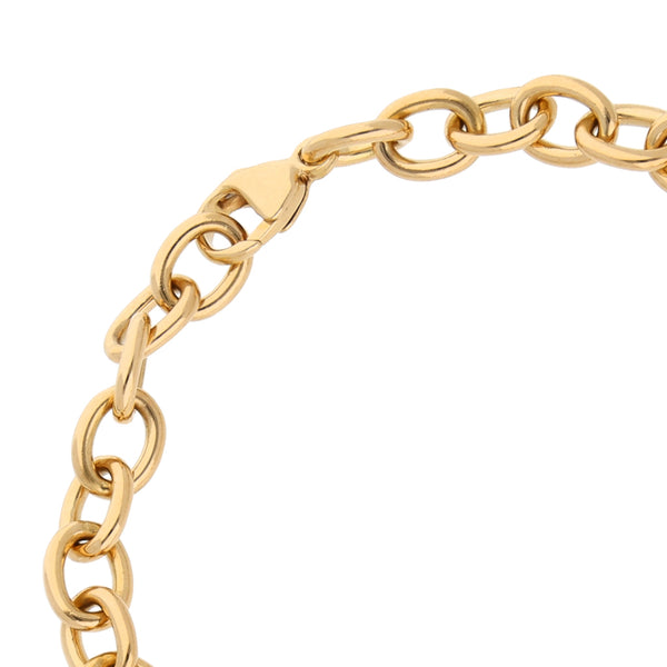 Pulsera eslabón cruzado con aplicación motivo corazón firma Tiffany & Co. en oro amarillo 18 kilates.