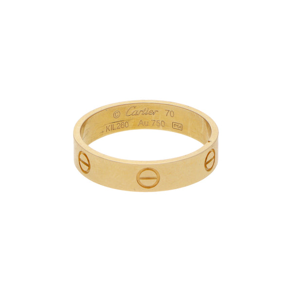 Argolla diseño especial motivo tornillos simulados firma Cartier en oro amarillo 18 kilates.